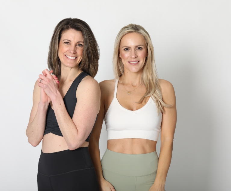 Kelly and Rachel standing together smiling